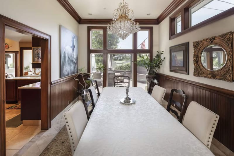 The dining room, set for a long table of guests