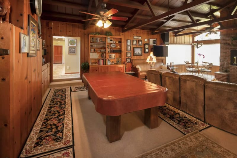 The pool table in the wood-panelled games room
